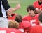 Coach lectures player at halftime