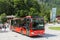 Coach with passengers leaving bus-stop in Berchtesgaden near the Konigssee