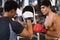 Coach thai are training men boxer with boxing glove  at the gym, fitness, boxing camp