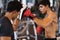 Coach thai are training men boxer with boxing glove  at the gym, fitness, boxing camp