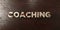 Coaching - grungy wooden headline on Maple - 3D rendered royalty free stock image