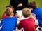 Coaching Soccer. Children Football Team with Coach at the Soccer Field