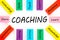 Coaching word with wooden block on white background. Training Planning Learning Coaching Business Guide Instructor Leader concept