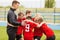 Coaching Youth Sports. Kids Soccer Football Team Huddle with Coach