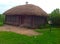Coachman`s hut - a wooden hut with a roof of straw