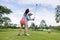 coachs are teaching and training female golfers in golf courses