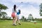 coachs are teaching and training female golfers in golf courses