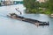 Coal barge sailing on the river