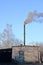 Coal boiler room with the smoking pipe. Kaliningrad region, Russ