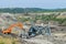 Coal mine accident with a heavy extraction machine inside the coal exploitation. The huge excavator collapsed in the open pit.