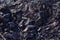 Coal mineral black as a cube stone background