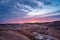 Coal mining at an open pit at sunset