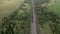 Coal train aerial view. An electric locomotive with freight cars or a railway carriage travels by rail.A train with coal is travel