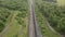 Coal train aerial view. An electric locomotive with freight cars or a railway carriage travels by rail.A train with coal is travel