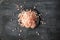 Coarse and fine Himalayan salt on a black background