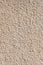 Coarse-grained textured gray background cement finish of the building facade with cement putty