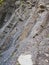 Coarse, Rough Gray Stone Or Rock Texture Of Mountains, Background And Copy Space For Text On Theme Geology And Mountaineering