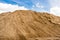 Coarse Sand Pile with cloudy sky.