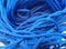 Coarse textured blue ropes with irregular and chaotic windings or turns