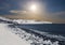 Coast Arctic ocean with stones covered