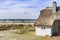 Coast Baltic Sea with dune grass and house