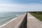 Coast and breakwater wave protection dike on Ile de RÃ© in France with the path