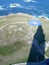 Coast and compass rose next to the lighthouse in the sea