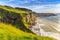 Coast with green grass nearby a carrick-rede-rob, Northern Ireland, UK.