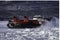 Coast Guard hovercraft breaking ice near a small community in eastern Quebec, Canada.