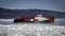 Coast Guard hovercraft breaking ice near a small community in eastern Quebec, Canada.