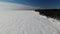 Coast Gulf Lake sea in ice with snow. snow dunes. ski track. Winter Aerial