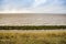 Coast of IJsselmeer near to Den Oever by  Afsluitdijk monument in Netherlands