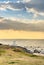 Coast of Itoshima Beach in Fukuoka with Sakurai Futamigaura`s white torii gate at sunset.