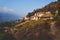 Coast at lake Atitlan with garden and sunlit houses, San Juan la Laguna, Guatemala