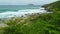 Coast line with beach and ocean with surfing waves in Brazil. Aerial view