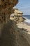 Coast of the Namibe Desert with canyons and wooden houses Angola. Africa