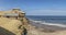 Coast of the Namibe Desert with canyons and wooden houses Angola. Africa