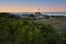 Coast of the ocean with a view of the lighthouse. Maine`s famous lighthouse at sunset. USA. Maine.