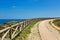 Coast of Sagres with hiking trail and wooden balustrade, Algarve, Portugal, Europe