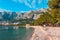 Coast sea and beach below mountain Biokovo in town of Makarska