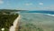 The coast of Siargao island, blue ocean and waves.