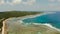 The coast of Siargao island, blue ocean and waves.