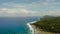 The coast of Siargao island, blue ocean and waves.