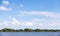 Coast of Volkhov River under blue sky