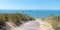 Coastal area with sand beach grass entrance to Atlantic ocean in Ile de Noirmoutier France in web banner template header