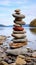 Coastal cairn Stones arranged in a seaside pyramid, a tranquil and natural monument