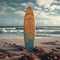 Coastal calmness Surfboard standing tall in the sandy shoreline