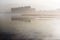 Coastal city reflected in the beach