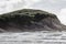 Coastal cliff fronts where the land meets the sea. Wharariki Beach