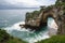 coastal cliff with natural archway and scenic ocean view